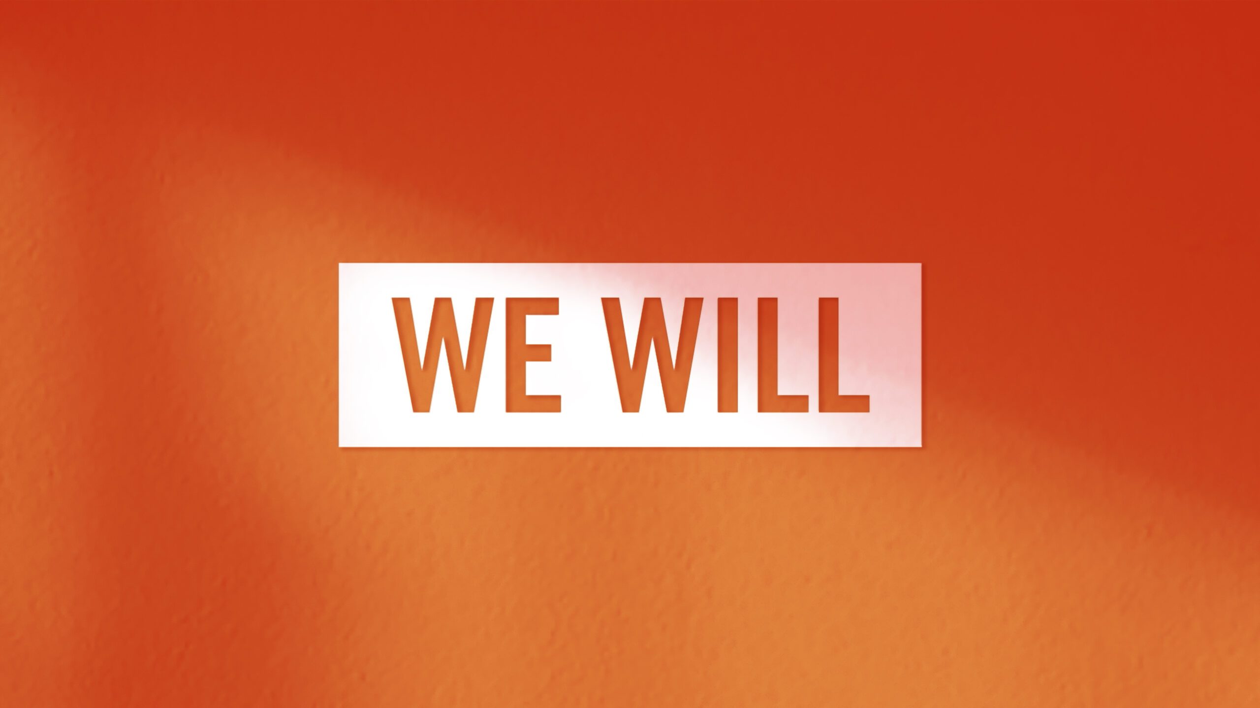 A red wall with the words " we will ".
